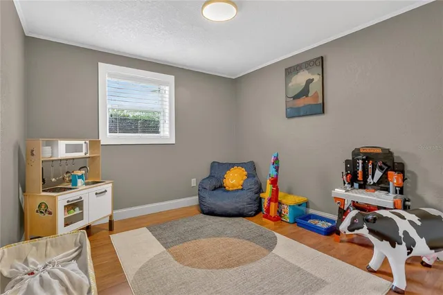 a bedroom with furniture and a book shelf