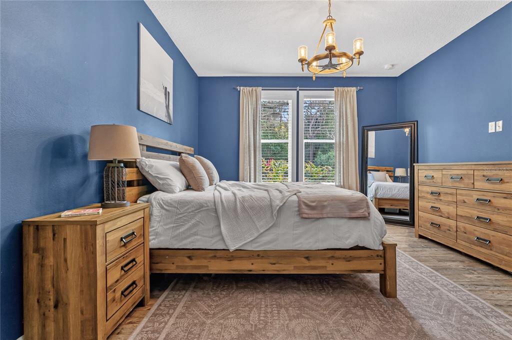 1795 Brumley Road Chuluota, FL 32766 - Photo 15 of 41 a bedroom with a bed and a dresser