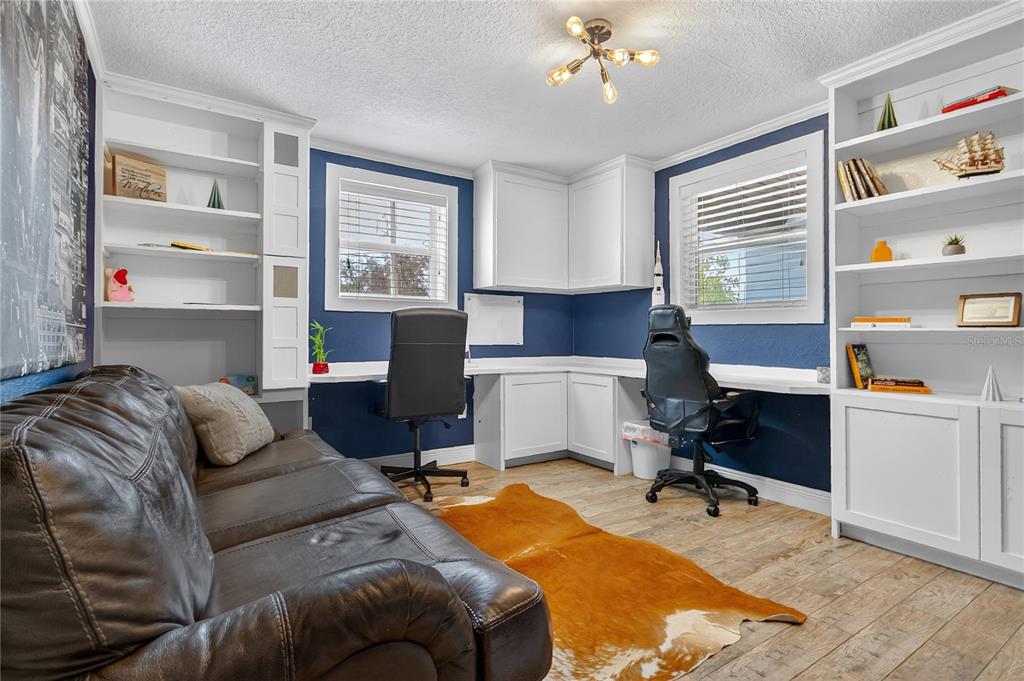 1795 Brumley Road Chuluota, FL 32766 - Photo 23 of 41 a view of a livingroom with workspace and a window