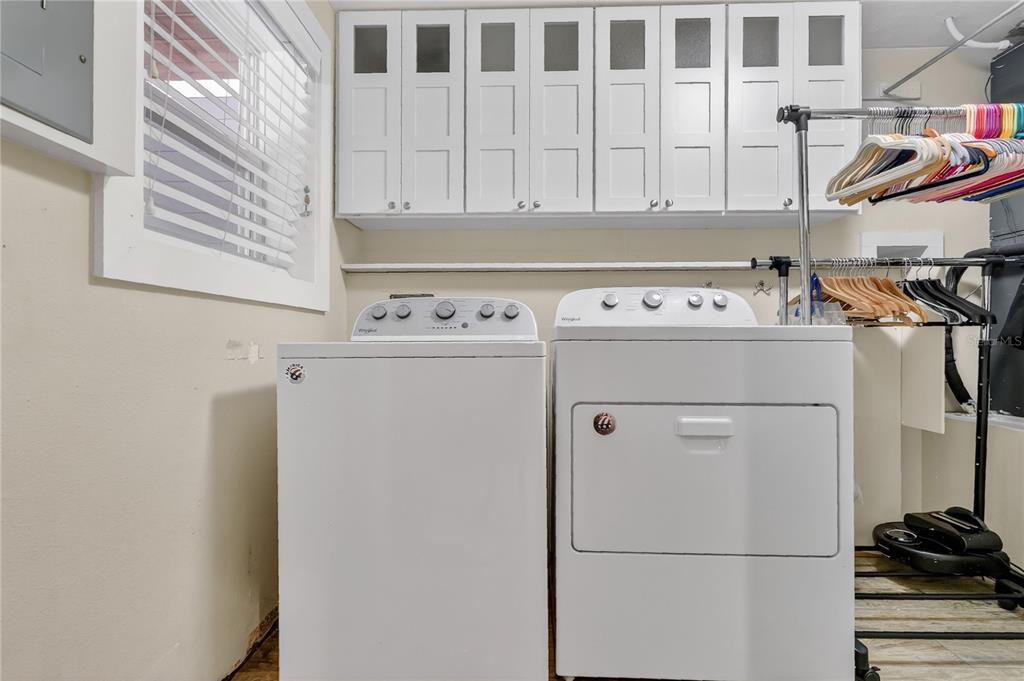 1795 Brumley Road Chuluota, FL 32766 - Photo 25 of 41 a view of washer and dryer with kitchen view
