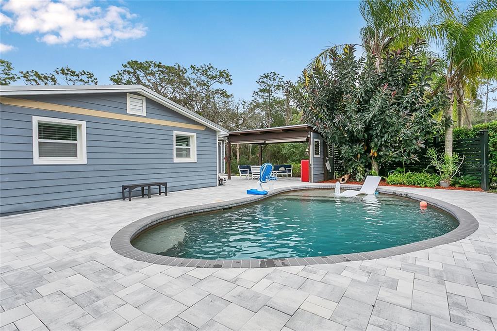 1795 Brumley Road Chuluota, FL 32766 - Photo 28 of 41 a view of a swimming pool with a yard