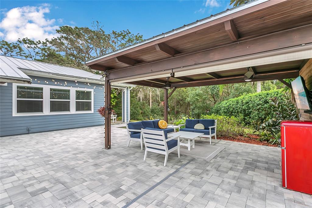 1795 Brumley Road Chuluota, FL 32766 - Photo 29 of 41 a chair and table in a backyard