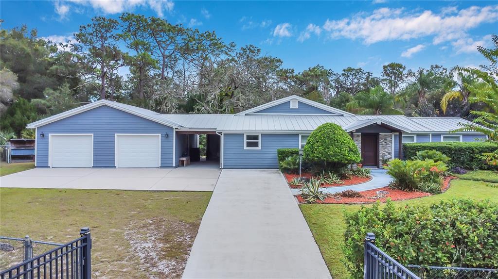 1795 Brumley Road Chuluota, FL 32766 - Photo 35 of 41 a front view of house with yard and trees in the background