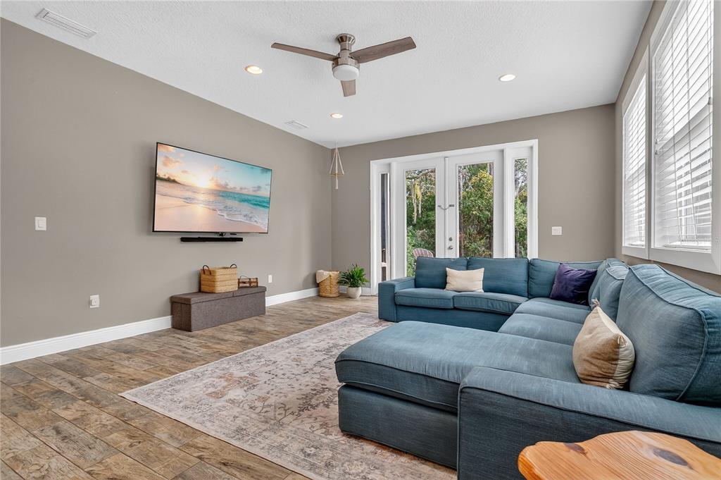 1795 Brumley Road Chuluota, FL 32766 - Photo 8 of 41 a living room with furniture ceiling fan and a rug