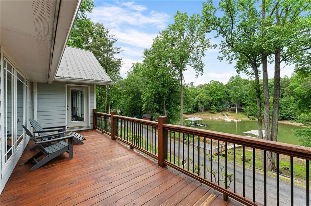 221 Reece Creek Road West Blairsville, GA 30512 - Photo 32 of 42 a view of a wooden deck and a yard