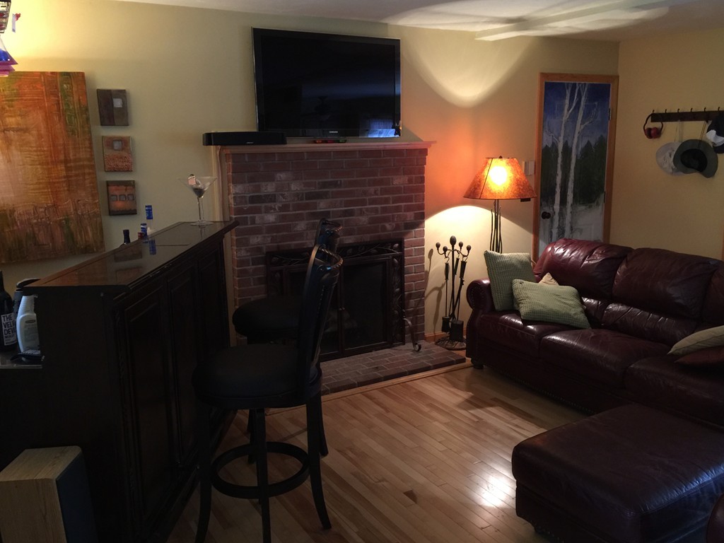 147 Great Road Shirley, MA 01464 - Photo 3 of 6 a living room with furniture and a fireplace