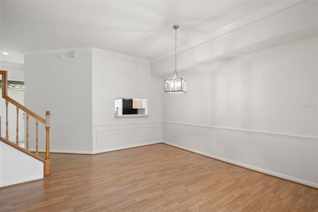 1644 Arabian Lane Palm Harbor, FL 34685 - Photo 15 of 52 a view of empty room with wooden floor and fan