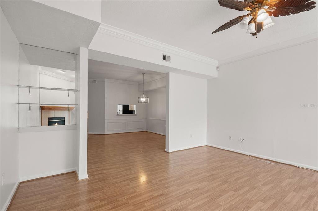 1644 Arabian Lane Palm Harbor, FL 34685 - Photo 18 of 52 a view of a big room with wooden floor and windows