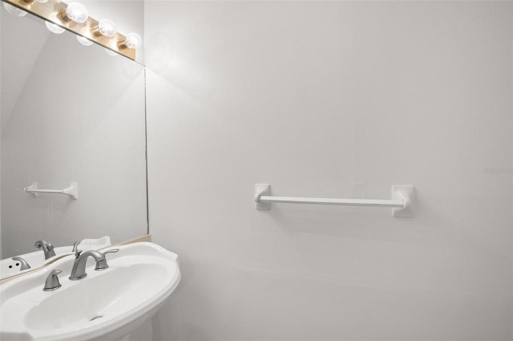 1644 Arabian Lane Palm Harbor, FL 34685 - Photo 20 of 52 a bathroom with a sink and mirror