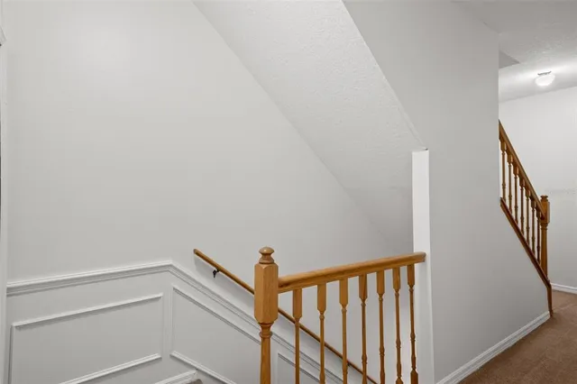 a view of a hallway with staircase