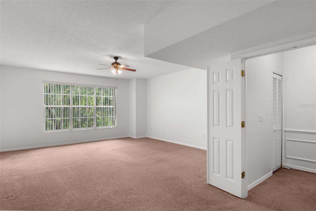 1644 Arabian Lane Palm Harbor, FL 34685 - Photo 23 of 52 a view of a livingroom with a ceiling fan and window