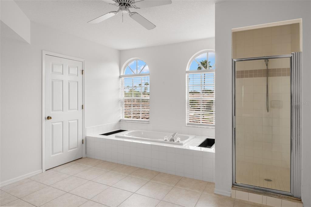 1644 Arabian Lane Palm Harbor, FL 34685 - Photo 27 of 52 a spacious bathroom with a bathtub and a shower