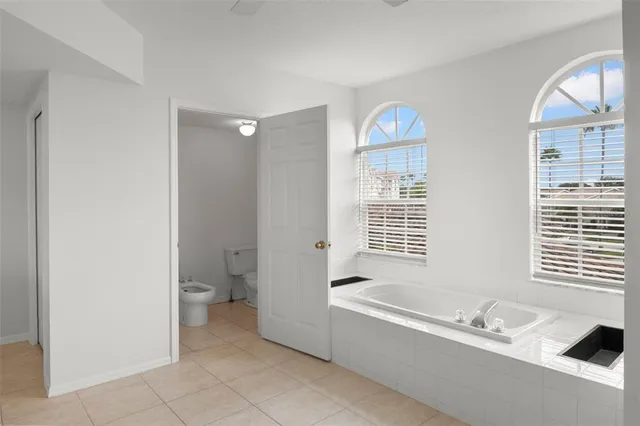 a bathroom with a bathtub and a sink