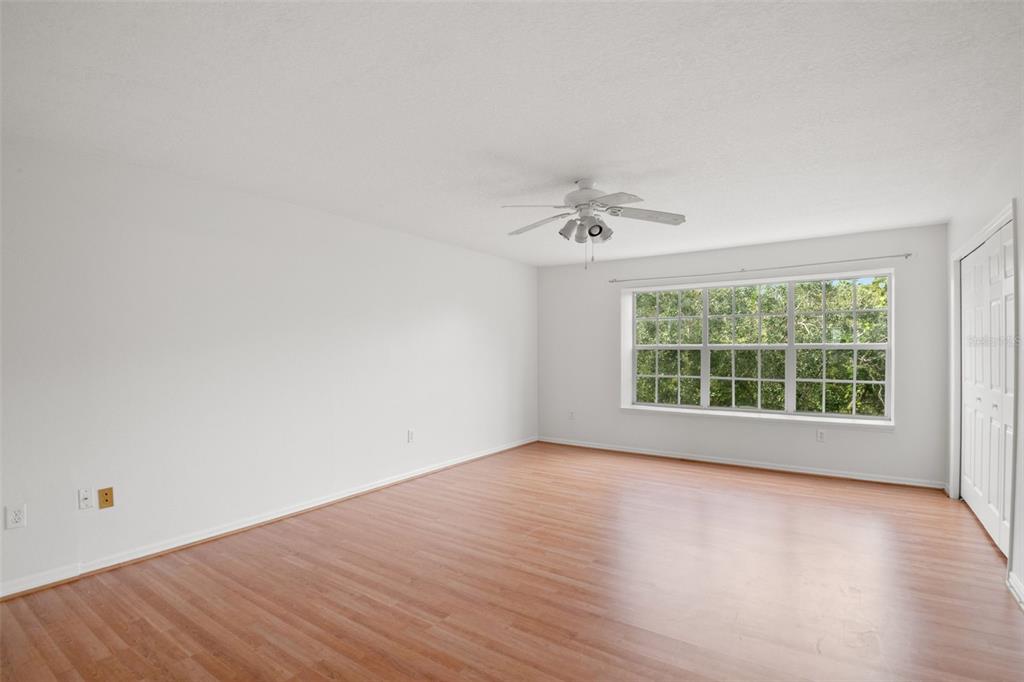 1644 Arabian Lane Palm Harbor, FL 34685 - Photo 32 of 52 wooden floor in an empty room with a window