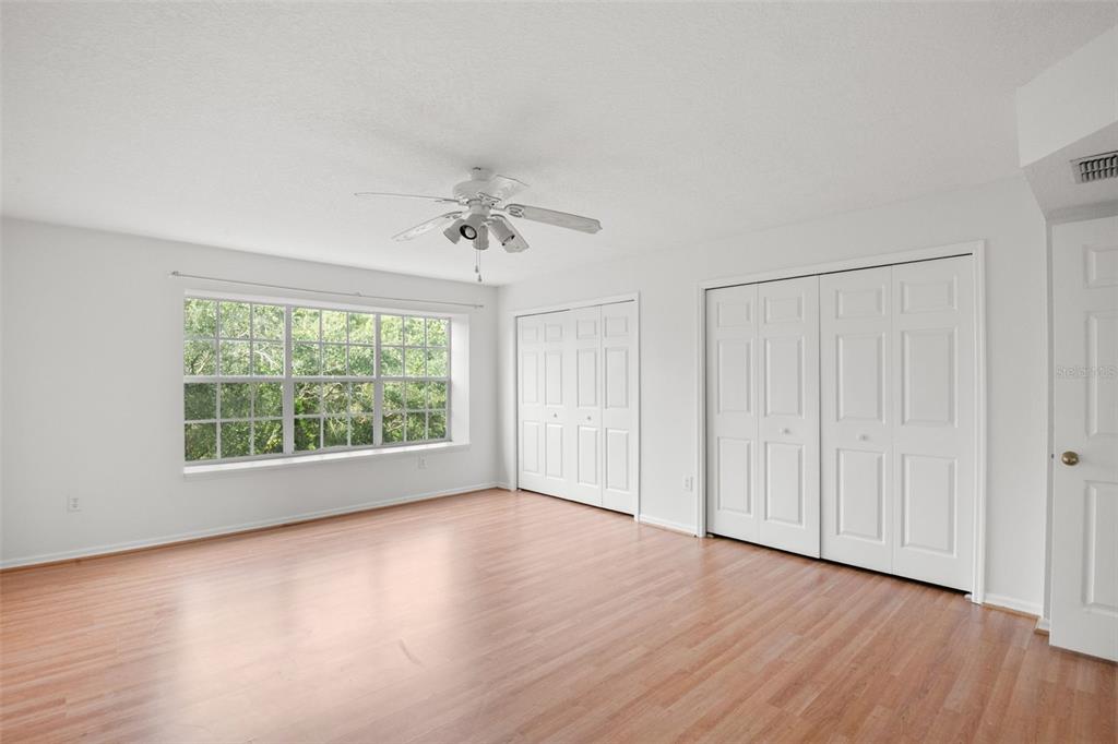 1644 Arabian Lane Palm Harbor, FL 34685 - Photo 33 of 52 wooden floor in an empty room with a window
