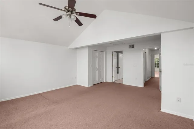 a view of a big room with carpet