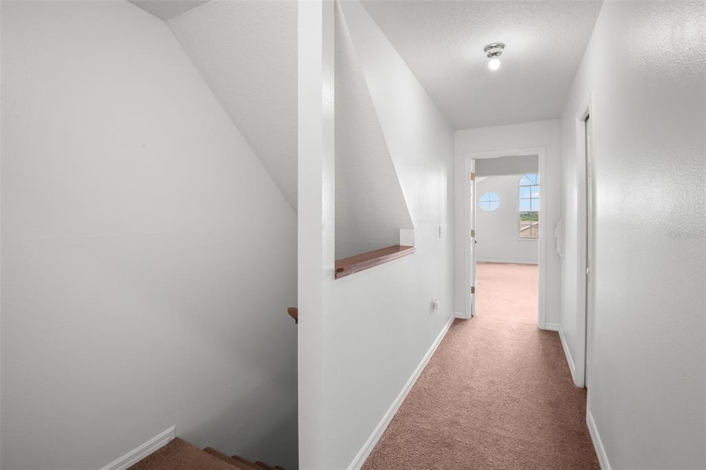 1644 Arabian Lane Palm Harbor, FL 34685 - Photo 45 of 52 a view of a hallway with a white walls