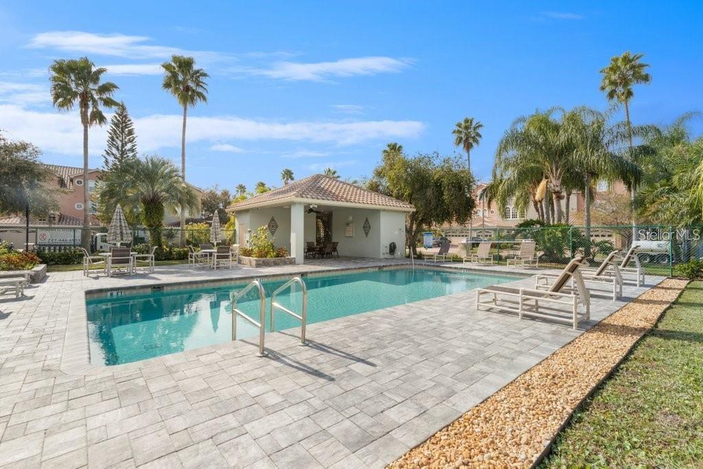 1644 Arabian Lane Palm Harbor, FL 34685 - Photo 47 of 52 a view of a house with a swimming pool and sitting area
