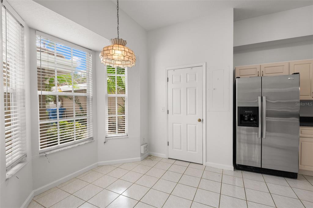 1644 Arabian Lane Palm Harbor, FL 34685 - Photo 8 of 52 a view of an empty room with window and chandelier