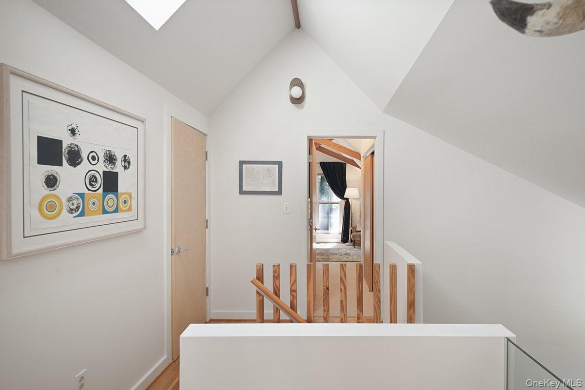 1821 Spring Valley Road Ossining, NY 10562 - Photo 33 of 48 Head up the wooden staircase to the second-floor landing, where you’ll find two bedrooms, a full bath, and a roomy storage closet. A skylight brightens the space from above.