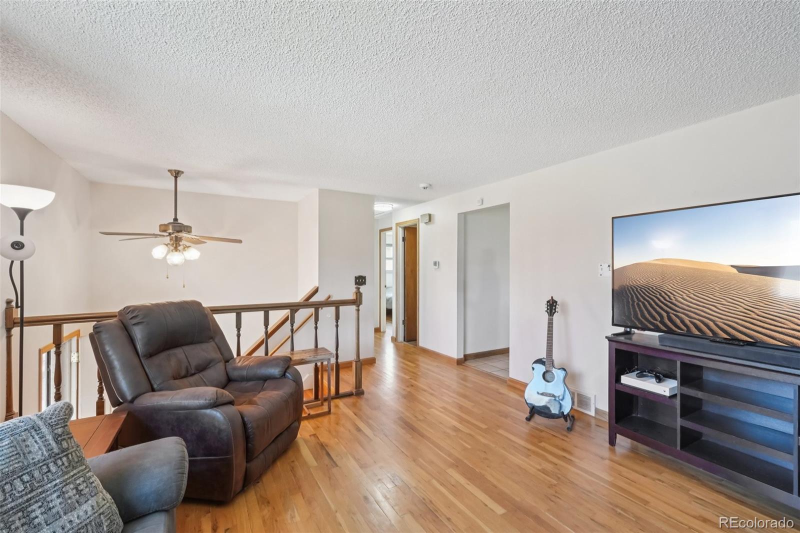 6277 Reed Court Arvada, CO 80003 - Photo 12 of 40 a living room with furniture and a wooden floor