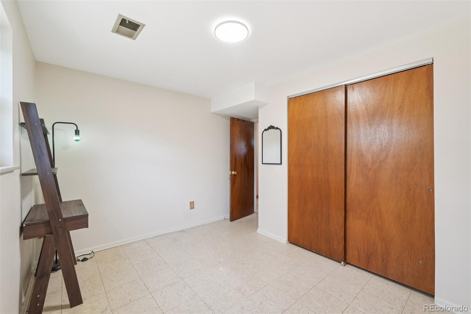6277 Reed Court Arvada, CO 80003 - Photo 22 of 40 a view of a room with gym equipment