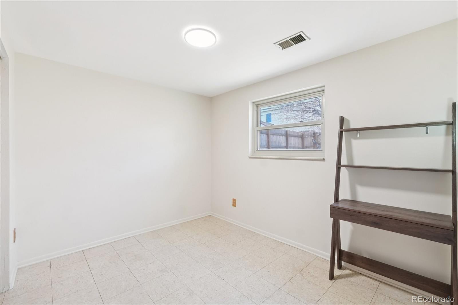 6277 Reed Court Arvada, CO 80003 - Photo 25 of 40 a view of room with window and hallway