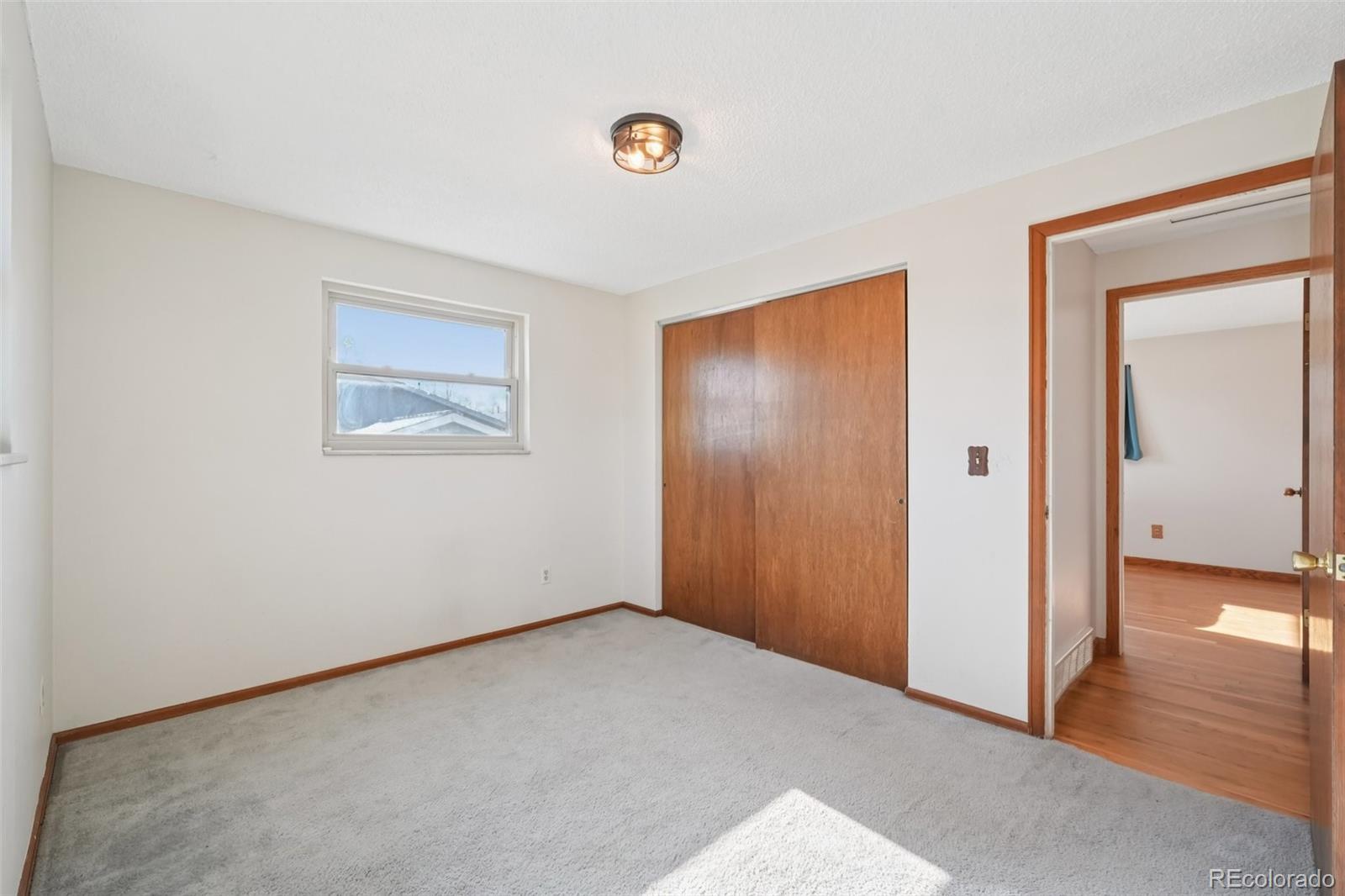 6277 Reed Court Arvada, CO 80003 - Photo 28 of 40 an empty room with windows