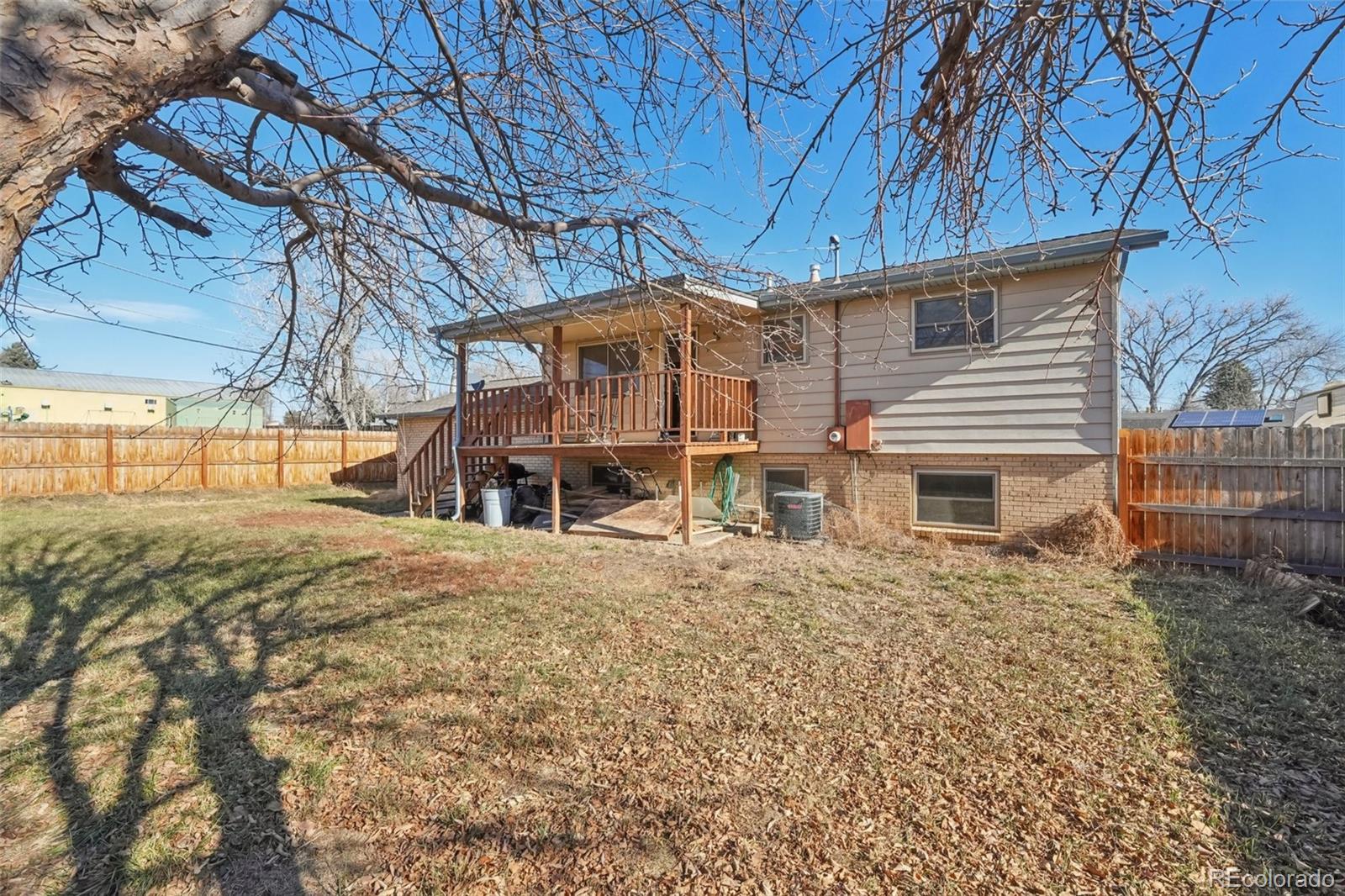 6277 Reed Court Arvada, CO 80003 - Photo 35 of 40 a view of a house with a yard