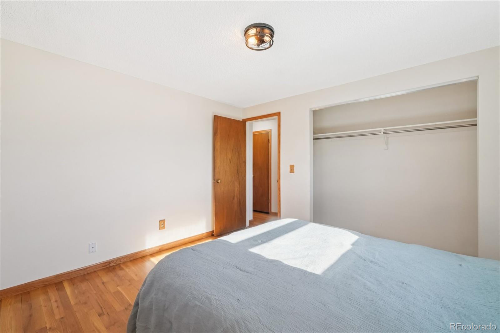 6277 Reed Court Arvada, CO 80003 - Photo 37 of 40 a bedroom with a bed and a window