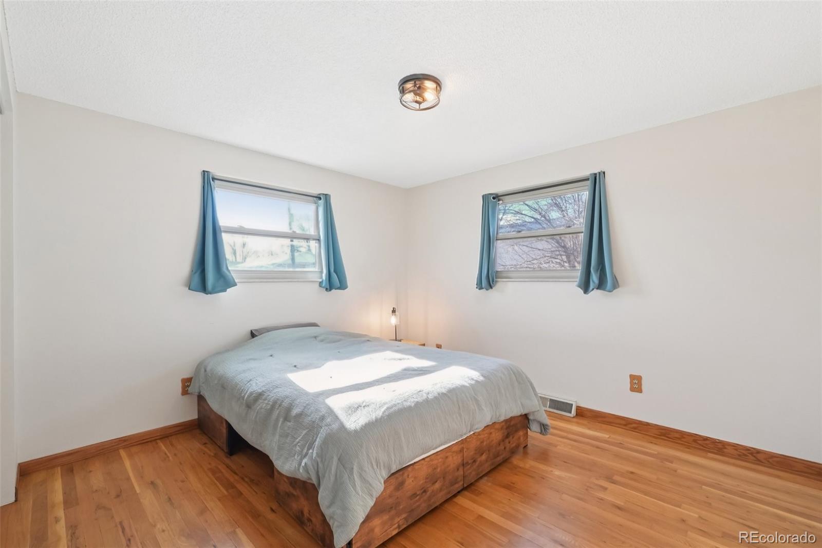6277 Reed Court Arvada, CO 80003 - Photo 38 of 40 a bedroom with a bed and a window