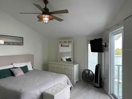 a bedroom with a bed and a view of bedroom