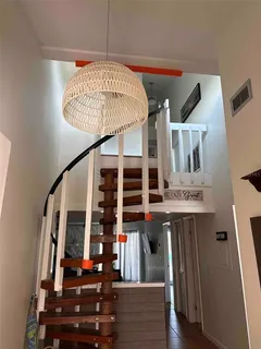 workspace with wooden floor outdoor seating and entryway