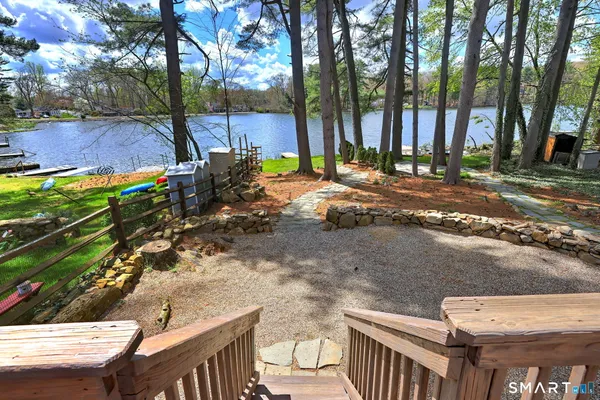 a view of a chair and table on the deck