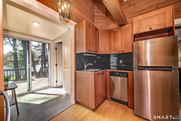 a kitchen with stainless steel appliances a refrigerator and a sink