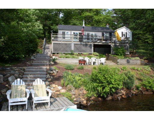 340 Mashapaug Road Holland, MA 01521 - Photo 1 of 1 a view of a chairs and table in the patio