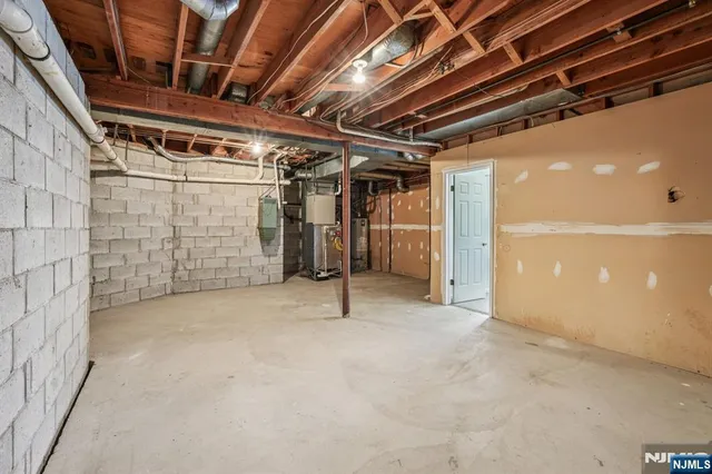 a view of empty room with wooden walls