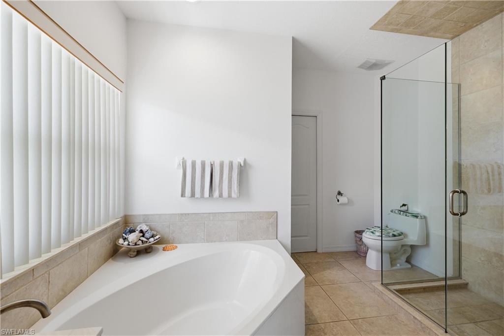 2958 Poplar Street Naples, FL 34112 - Photo 13 of 49 a bathroom with a sink and a mirror