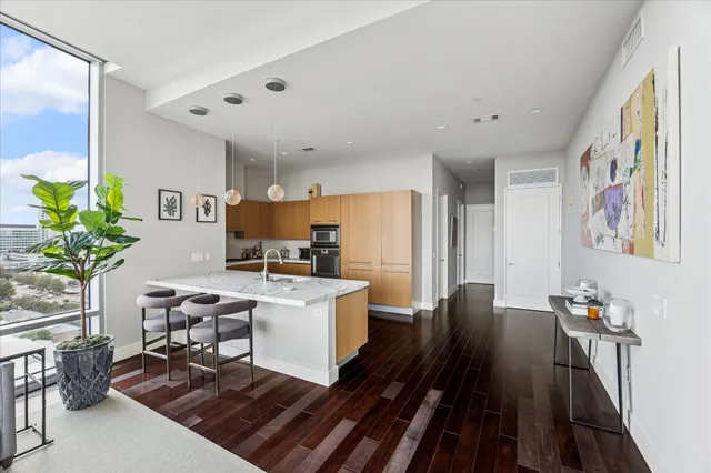 a view of a workspace with furniture and a kitchen