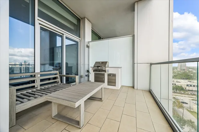 a view of a balcony with table and chairs