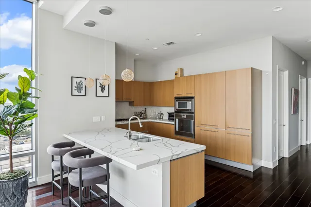 a kitchen that has a sink and a refrigerator