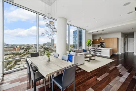 a view of a dining room with furniture window and wooden floor
