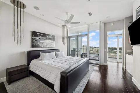 a bedroom with a large bed and a large window