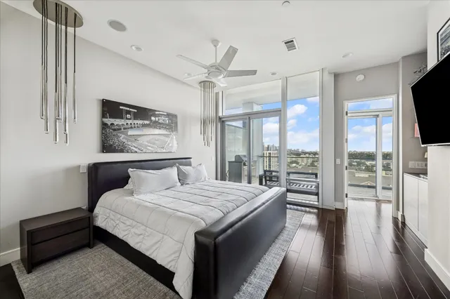 a bedroom with a large bed and a large window