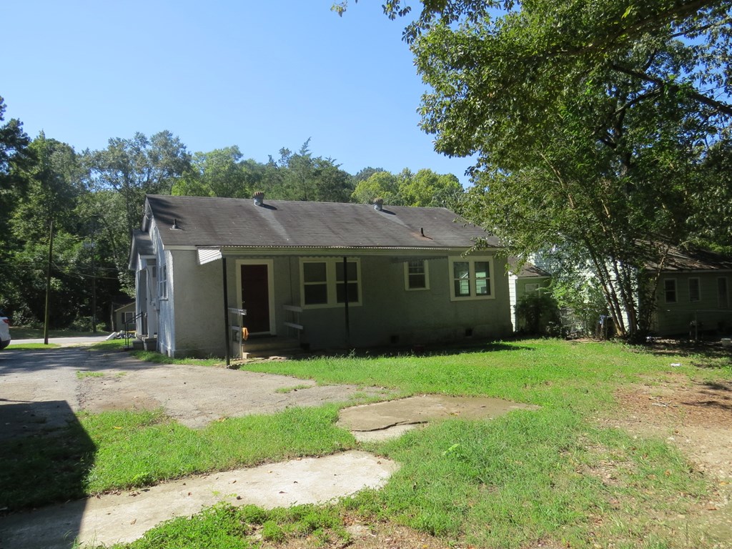 4247 Forrest Road Columbus, GA 31907 - Photo 11 of 17 a front view of a house with a yard and trees