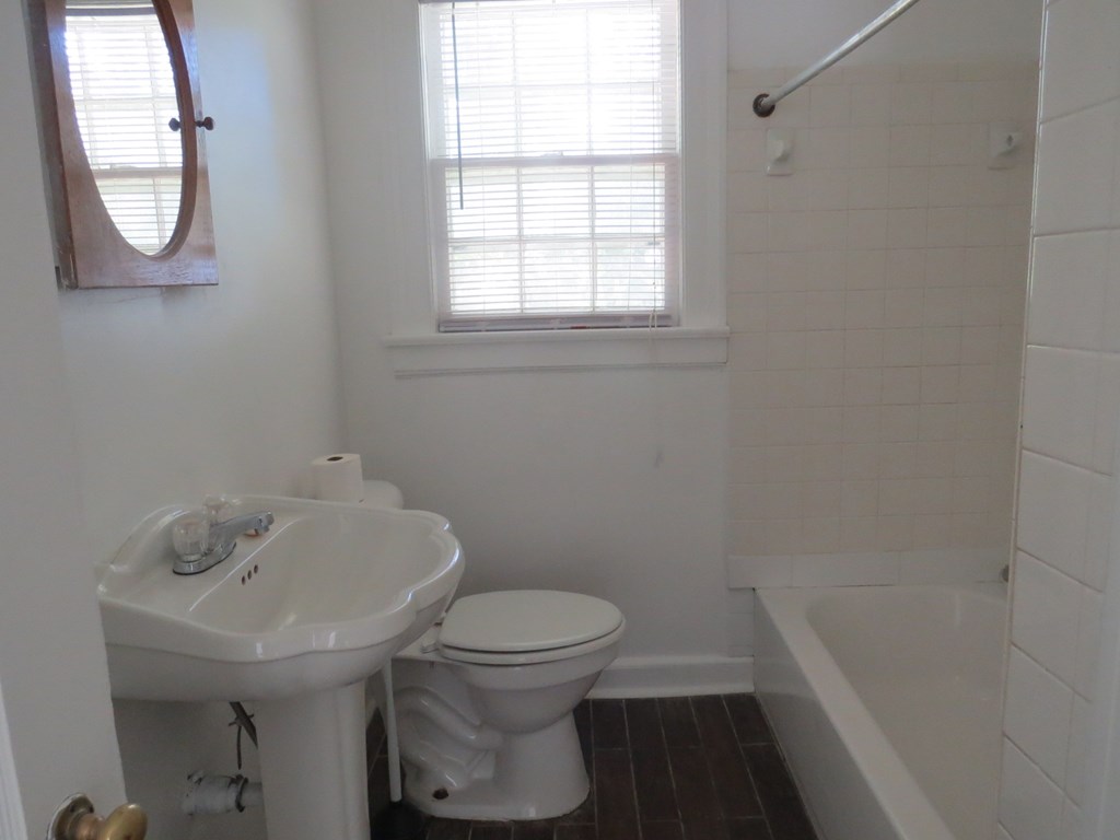 4247 Forrest Road Columbus, GA 31907 - Photo 9 of 17 a bathroom with a sink a toilet and a bathtub