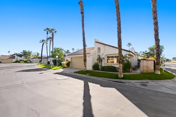 a view of a house next to a yard