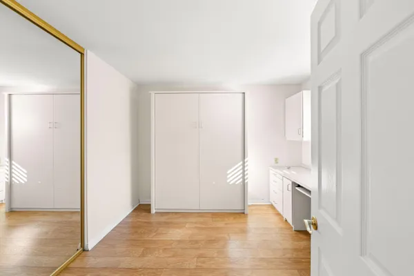 a bathroom with a sink vanity and a mirror
