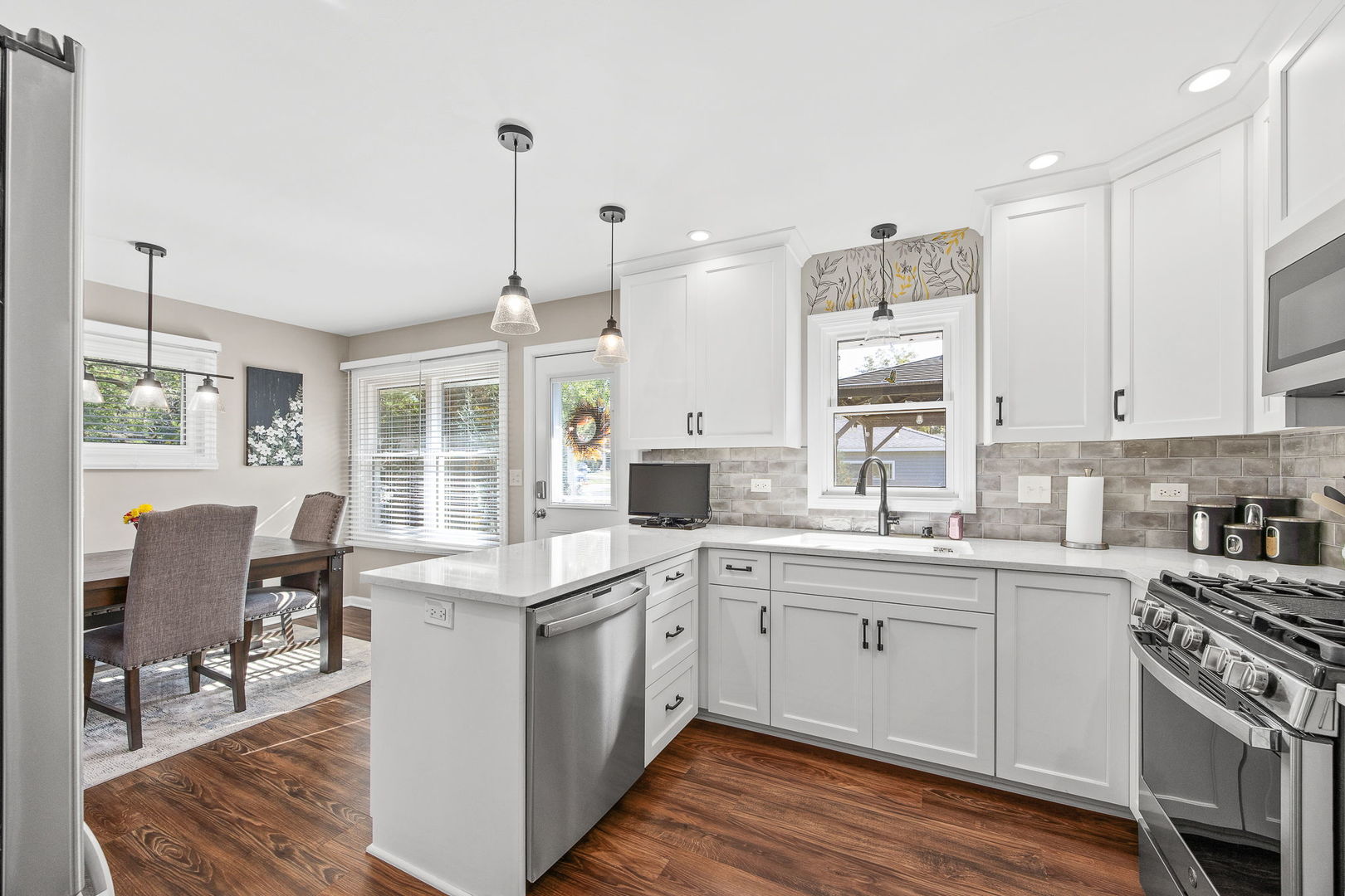 723 Inverness Road Lisle, IL 60532 - Photo 11 of 40 a kitchen with a sink stove and wooden cabinets