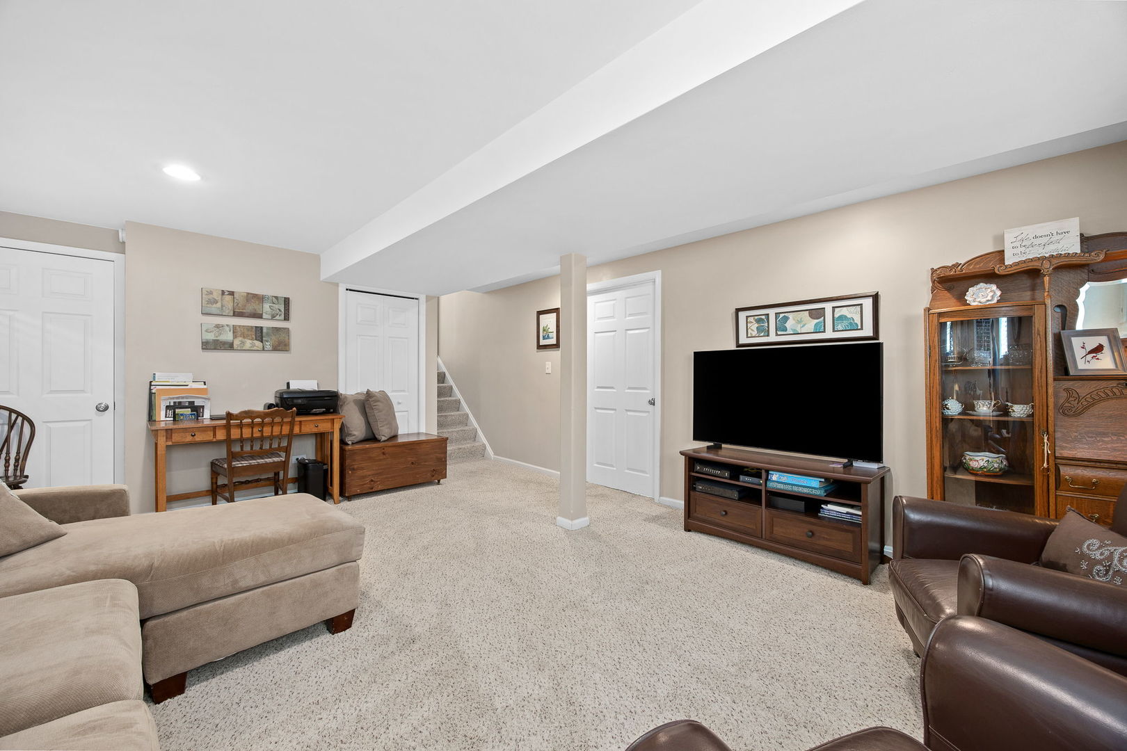 723 Inverness Road Lisle, IL 60532 - Photo 19 of 40 a living room with furniture and a flat screen tv